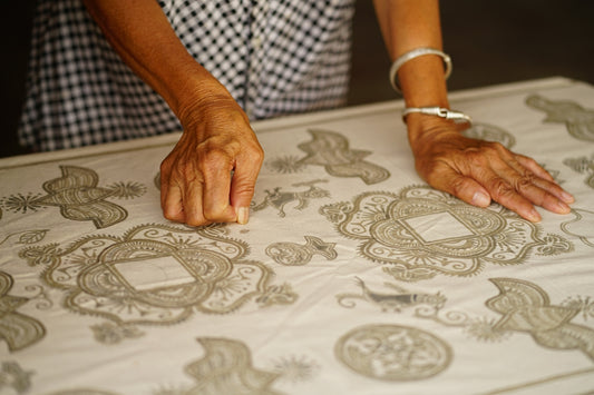 person holding textile