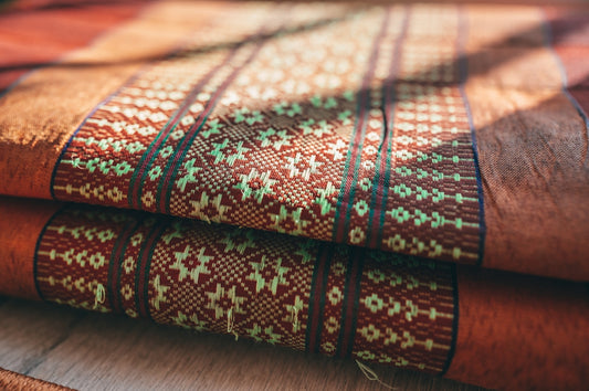 green white and brown textile