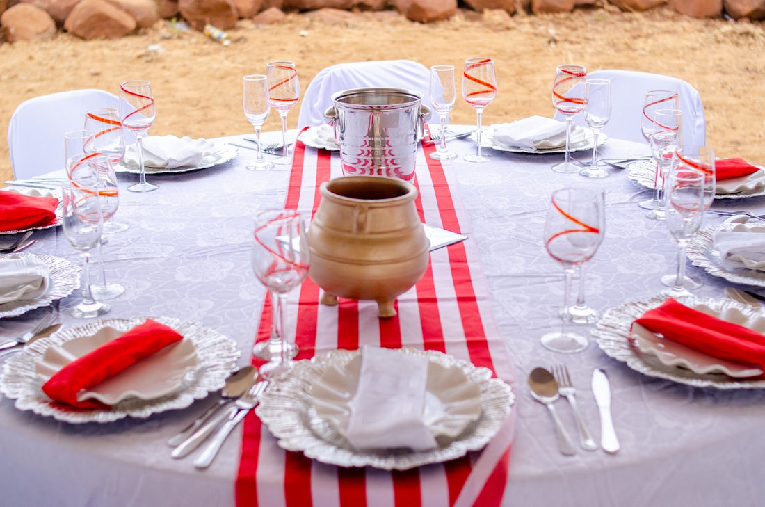 stainless steel fork and bread knife on white and red checkered table cloth