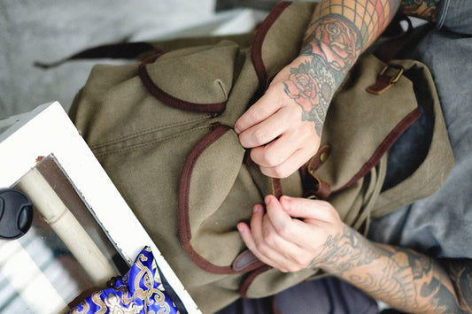 a person with tattoos on their arm