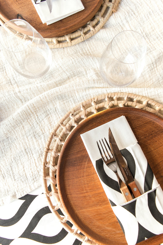 a wooden plate with a fork and knife on it