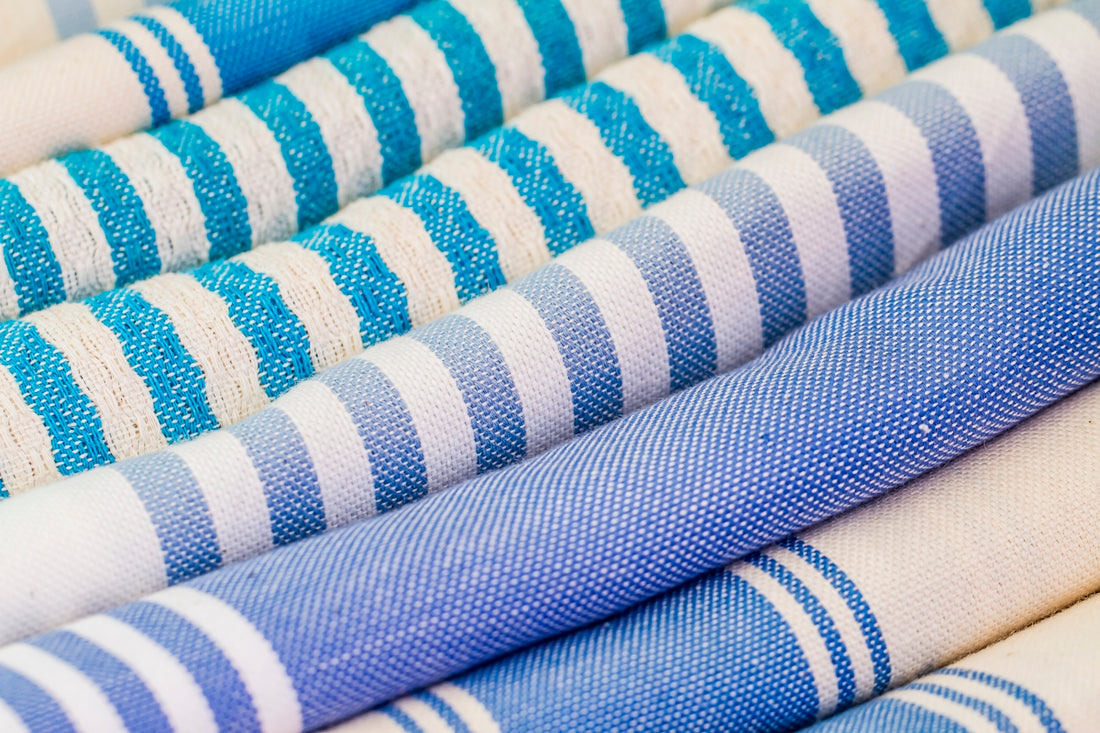a group of blue and white striped fabrics