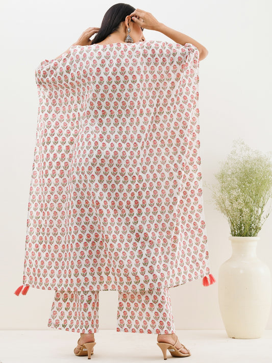 a woman is holding a white and red blanket