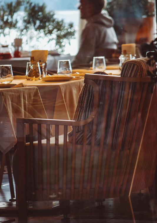 a restaurant with a table and chairs in front of a window