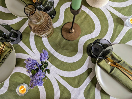 a table topped with plates and glasses on top of a table