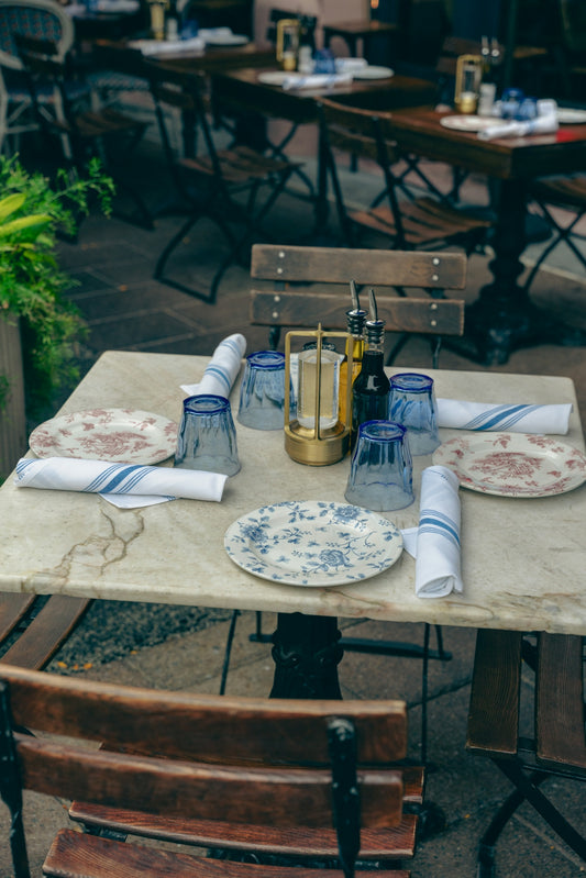 a table with plates and napkins on it